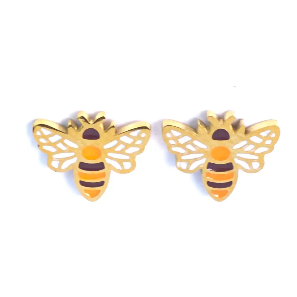 Front view of Michelle Stephen’s bee stud earrings, featuring gold-plated finish with orange, yellow, and black enamel details and white patterned wings.