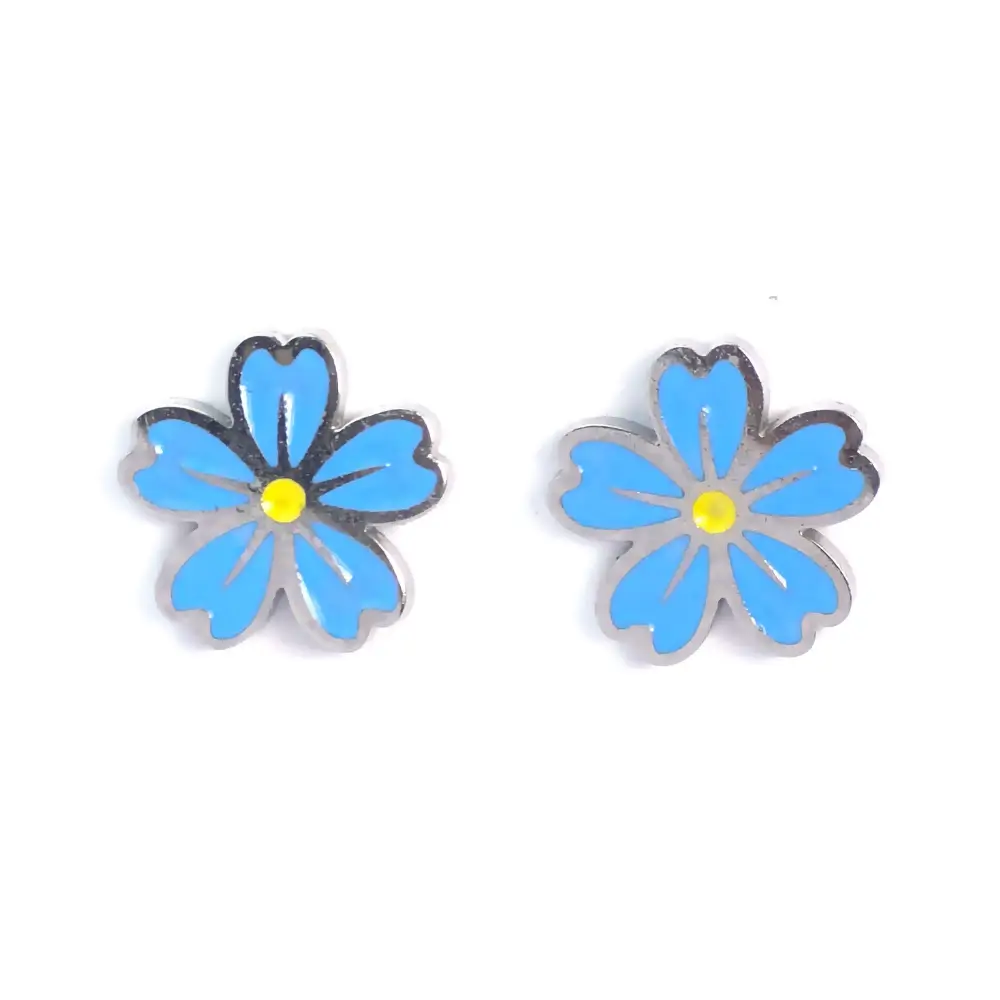 Pair of silver stud earrings shaped like six-petaled blue flowers with yellow centers, shown from a top-down view, displaying both earrings side by side.
