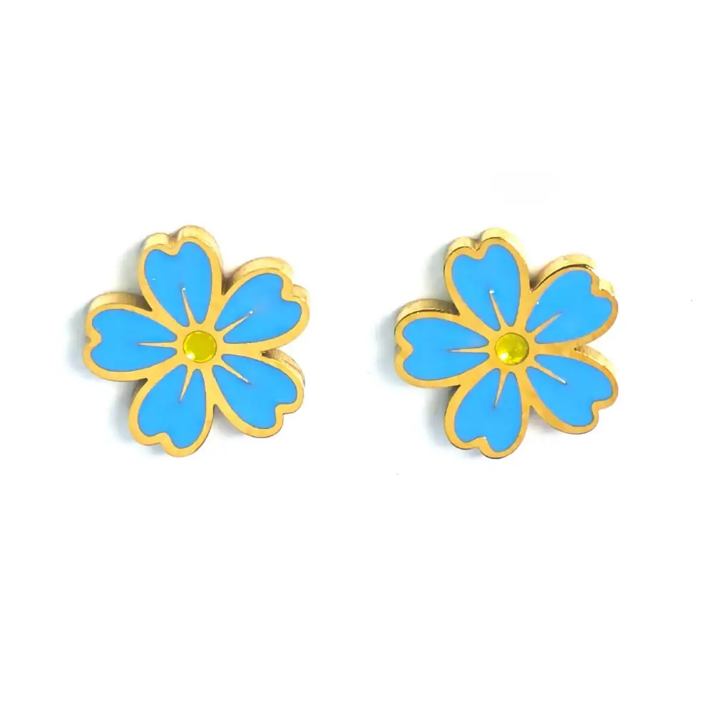 Gold-trimmed stud earrings shaped like a blue and yellow forget-me-not flower.