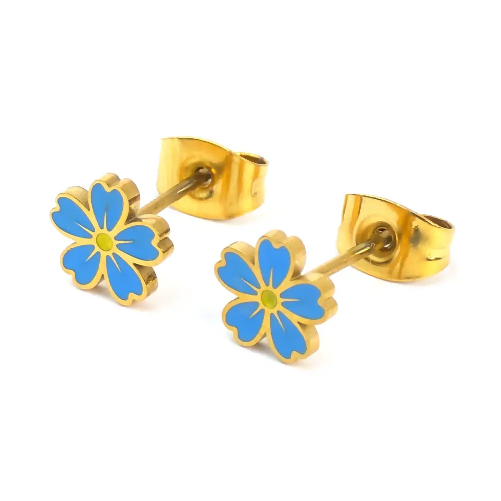 Gold-trimmed stud earrings shaped like a blue and yellow forget-me-not flower, shown with the gold earring backs attached.