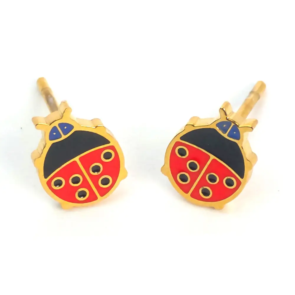 Red and black ladybug studs with gold trim.