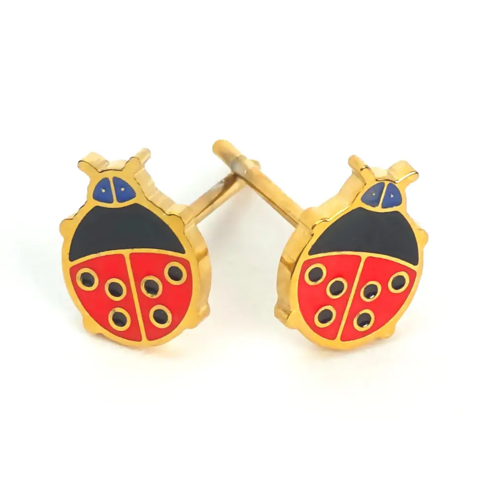 Gold-tone ladybug stud earrings with red and black enamel detailing.