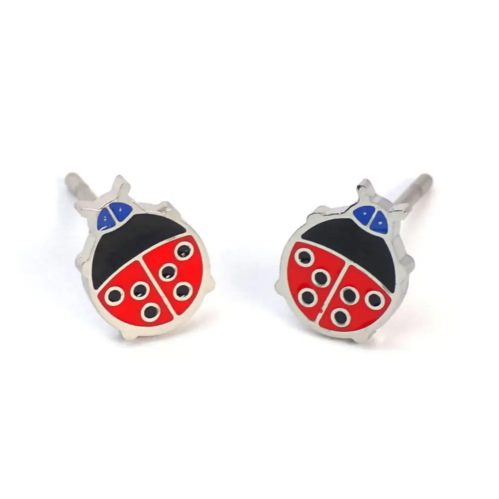 Silver-trimmed stud earrings shaped like a red and black ladybug with blue accents.