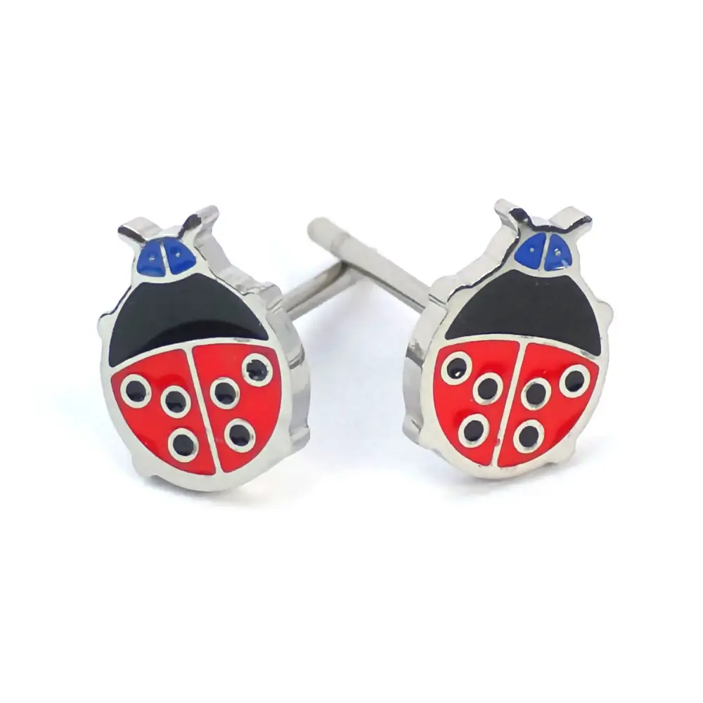 Silver-trimmed stud earrings shaped like a red and black ladybug with blue accents.