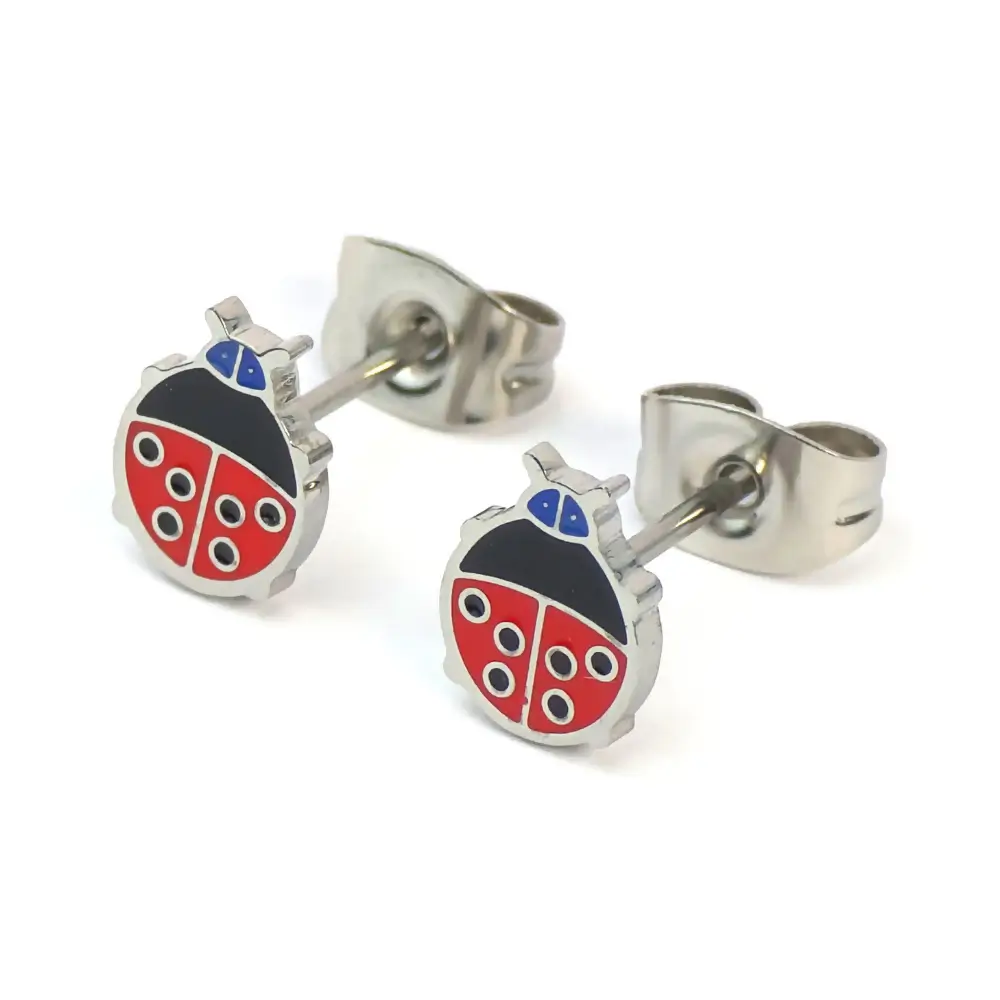 Silver-trimmed stud earrings shaped like a red and black ladybug, shown with the metal earring backs attached.