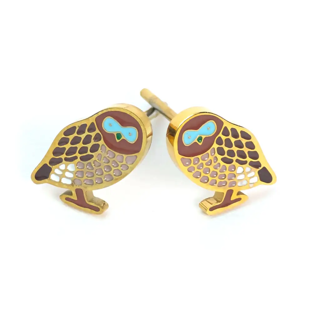 Gold owl studs with brown and blue accents.