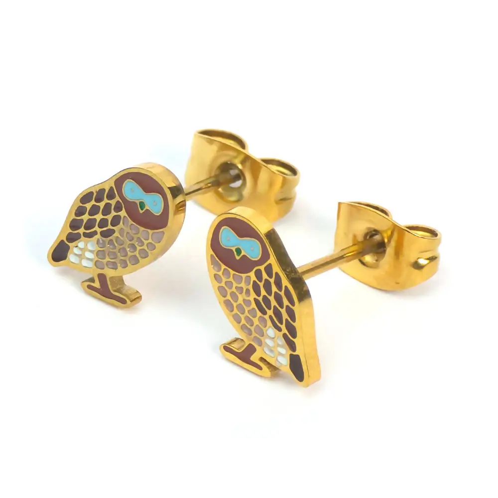 Small gold owl earrings with turquoise eyes.