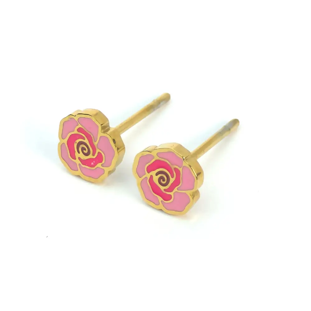 Close-up view of a pair of small stud earrings shaped like roses. The earrings have gold-tone metal outlines with pink and darker pink enamel petals, and visible posts with butterfly backings.