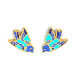 Gold stud earrings shaped like small blue swallows in flight.